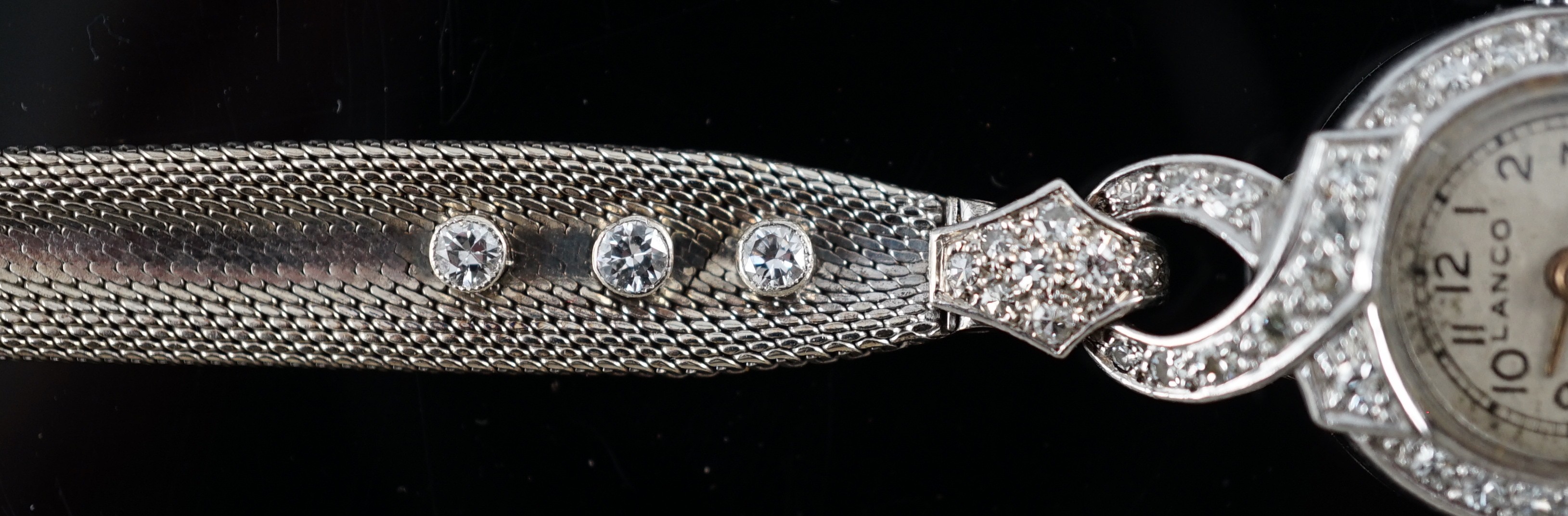 A lady's platinum and diamond set Lanco manual wind cocktail watch, on a 9ct gold and six stone diamond set bracelet